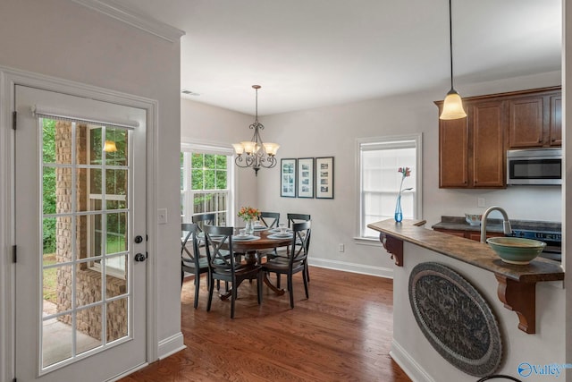117 Somerset Park Dr NE, Huntsville, AL 35811 - dining room with baseboards, dark wood finished floors, and a chandelier