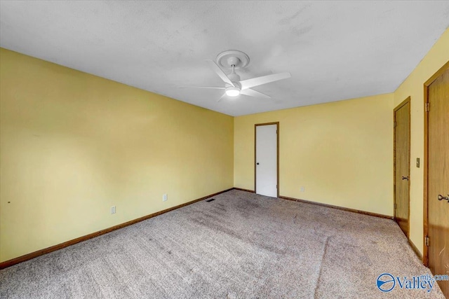 unfurnished bedroom featuring ceiling fan and carpet