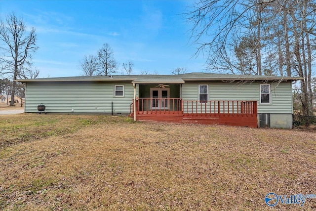 view of front of property with a wooden deck, a front lawn, and ceiling fan