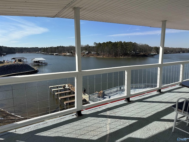 exterior space with a balcony and a water view