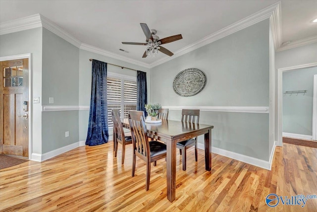 dining area featuring ceiling fan, light hardwood / wood-style flooring, and crown molding