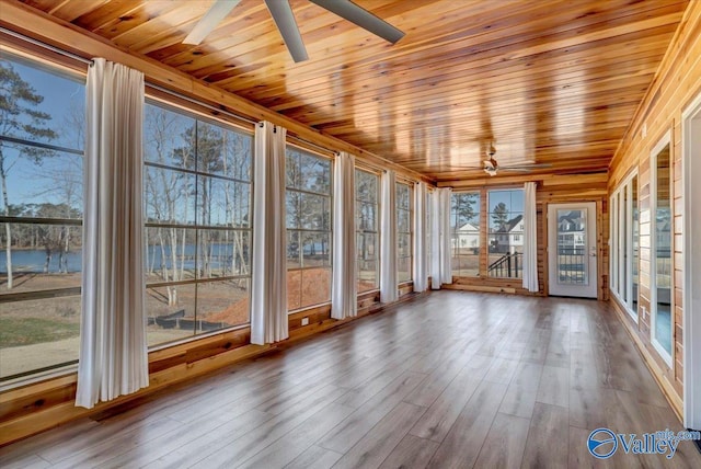 unfurnished sunroom with wooden ceiling and ceiling fan