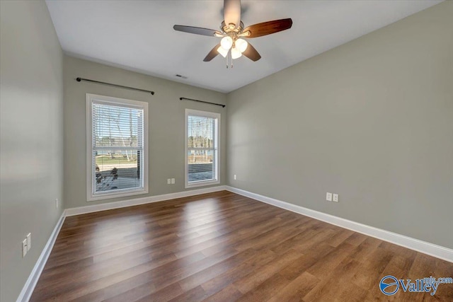 empty room featuring ceiling fan and wood-type flooring