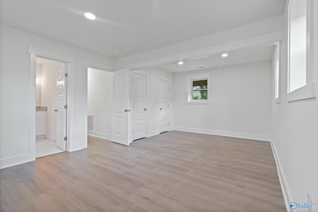 3631 NW Stag Run Dr, Huntsville, AL 35810 - unfurnished bedroom with light wood-style flooring, baseboards, recessed lighting, and connected bathroom