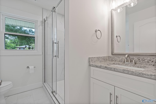 3631 NW Stag Run Dr, Huntsville, AL 35810 - bathroom with marble look tile flooring, toilet, a marble finish shower, vanity, and baseboards