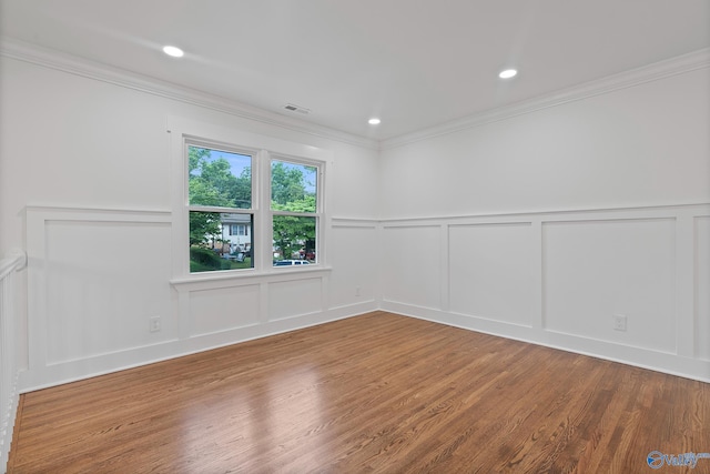 3631 NW Stag Run Dr, Huntsville, AL 35810 - spare room featuring a decorative wall, wood finished floors, crown molding, and wainscoting