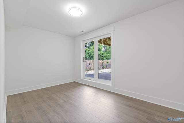 3631 NW Stag Run Dr, Huntsville, AL 35810 - spare room with wood finished floors and baseboards