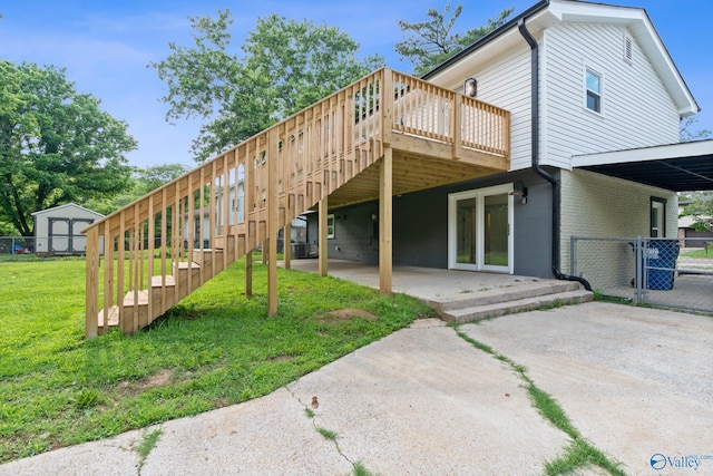 3631 NW Stag Run Dr, Huntsville, AL 35810 - rear view of property with a wooden deck, a gate, stairs, and a patio