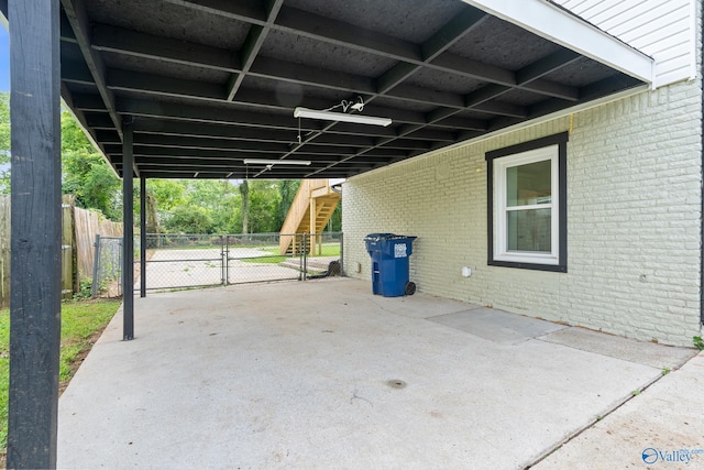 3631 NW Stag Run Dr, Huntsville, AL 35810 - view of car parking with stairs, a carport, and a gate