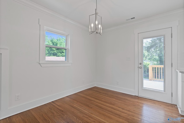 3631 NW Stag Run Dr, Huntsville, AL 35810 - unfurnished dining area featuring a chandelier, wood finished floors, ornamental molding, and baseboards