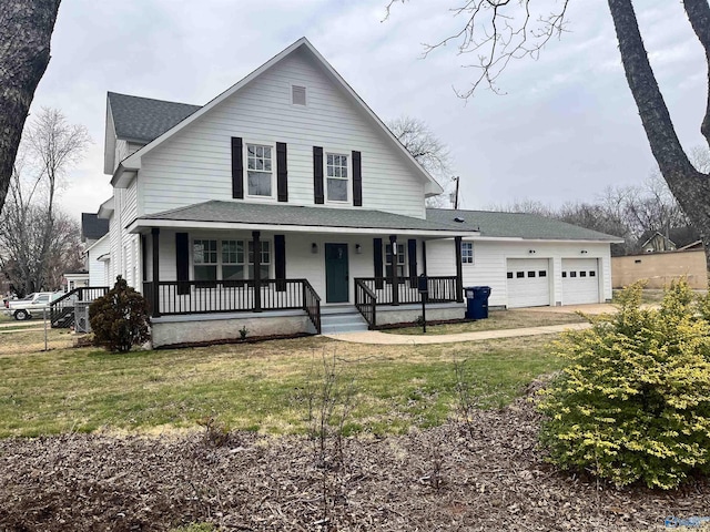 view of front of house with an attached garage, covered porch, driveway, and a front lawn