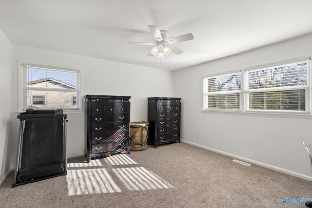 carpeted bedroom with ceiling fan