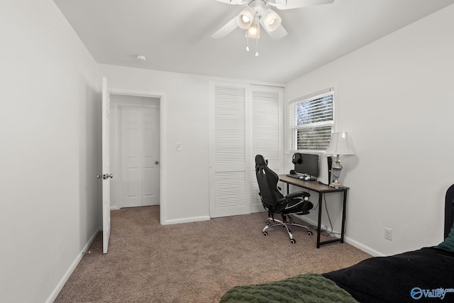 carpeted bedroom featuring a closet and ceiling fan