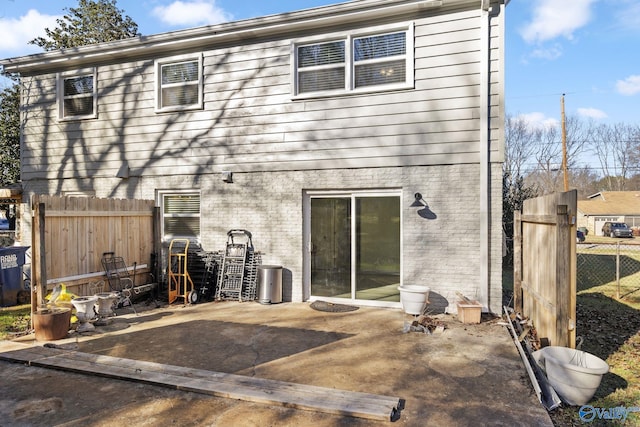 rear view of house featuring a patio