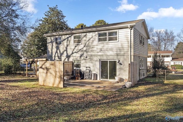 back of house with a patio, central AC unit, and a lawn