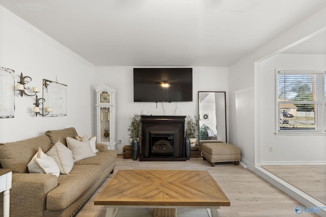 living room with light hardwood / wood-style floors