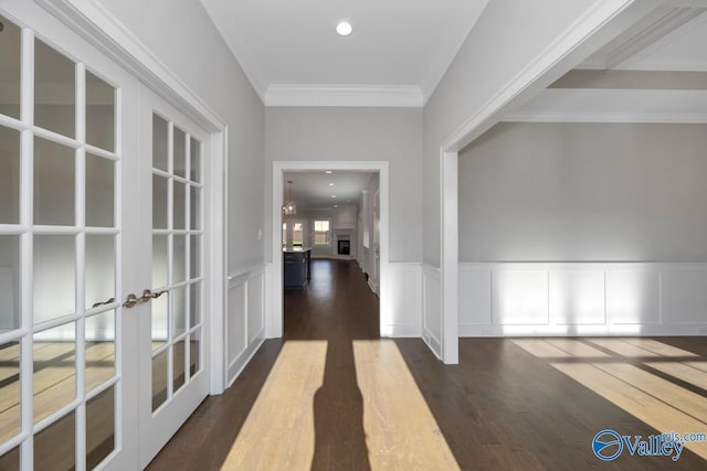 66 Natures Ridge Way, Huntsville, AL 35803 - hall with french doors, dark wood finished floors, crown molding, a wainscoted wall, and a decorative wall