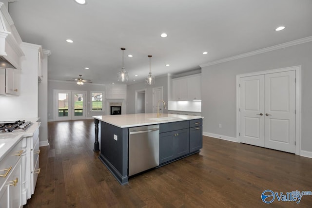 66 Natures Ridge Way, Huntsville, AL 35803 - kitchen featuring appliances with stainless steel finishes, ceiling fan, white cabinetry, crown molding, and open floor plan