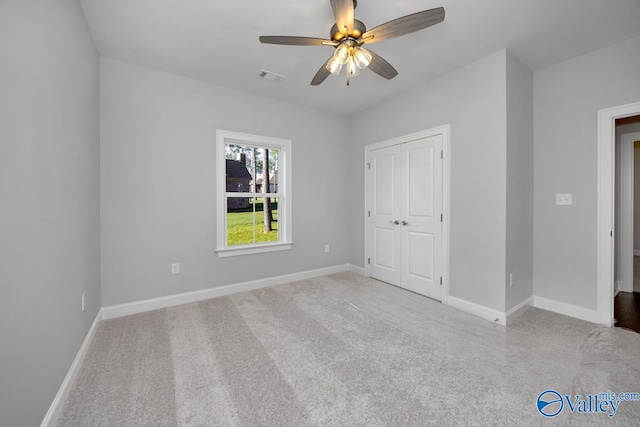 66 Natures Ridge Way, Huntsville, AL 35803 - unfurnished bedroom featuring carpet, a closet, and a ceiling fan