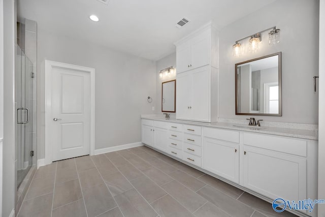 66 Natures Ridge Way, Huntsville, AL 35803 - full bathroom with double vanity, a shower stall, and recessed lighting