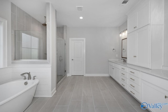 66 Natures Ridge Way, Huntsville, AL 35803 - full bath with a shower stall, a soaking tub, double vanity, recessed lighting, and tile patterned floors