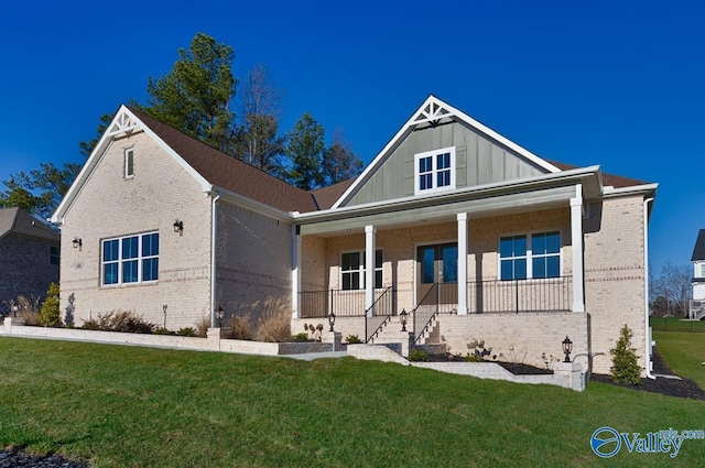 66 Natures Ridge Way, Huntsville, AL 35803 - view of front of property featuring brick siding, board and batten siding, and a front lawn