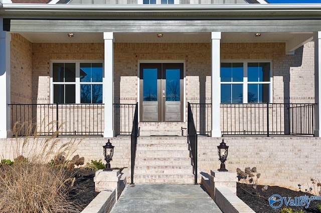 66 Natures Ridge Way, Huntsville, AL 35803 - entrance to property with brick siding, a porch, and french doors