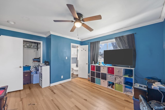 recreation room with light hardwood / wood-style floors, ceiling fan, and crown molding