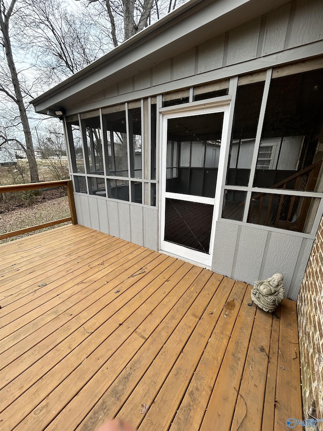 wooden terrace with a sunroom