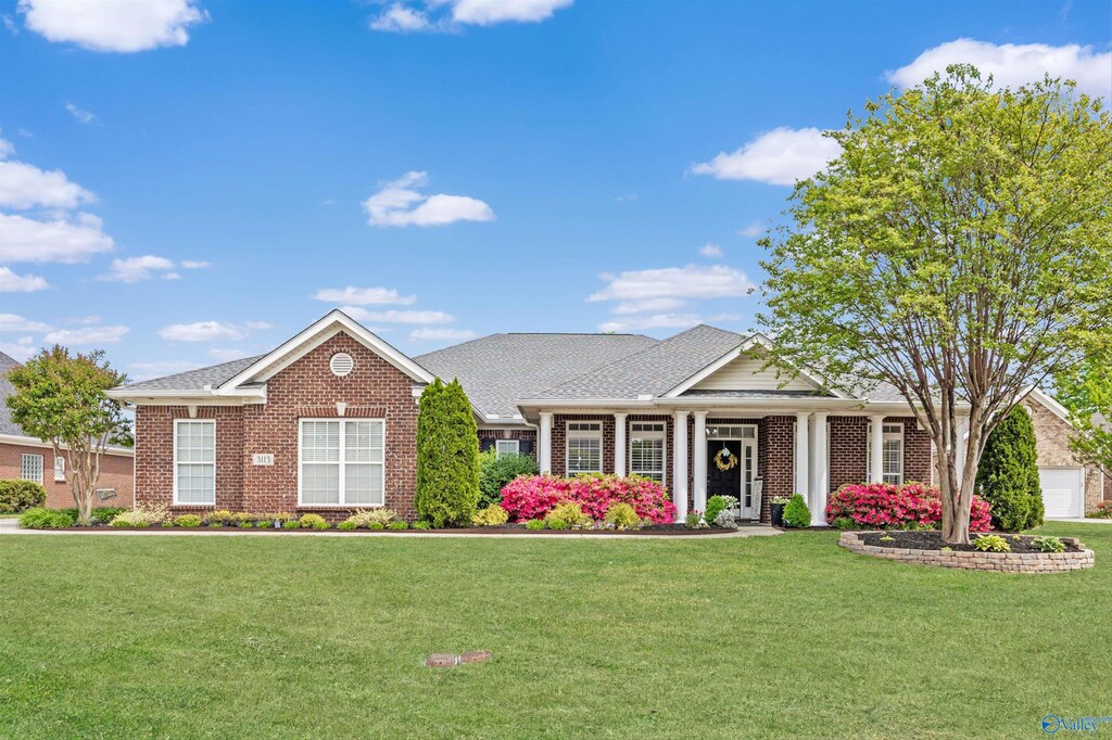 3113 Mossy Rock Rd SE, Owens Cross Roads, AL 35763 - craftsman inspired home with brick siding and a front yard