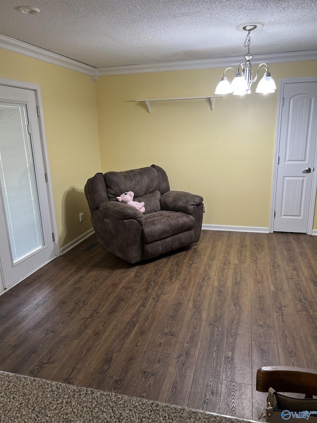 2143 Meadowood Dr, Southside, AL 35907 - living area featuring crown molding, wood finished floors, a textured ceiling, and a chandelier