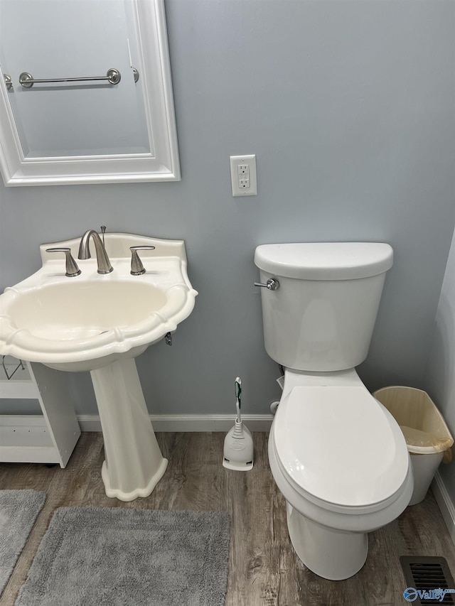 2143 Meadowood Dr, Southside, AL 35907 - half bath featuring baseboards, wood finished floors, toilet, and a sink