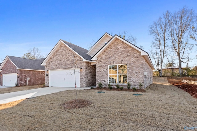 view of front of property featuring an attached garage, a front yard, concrete driveway, and brick siding