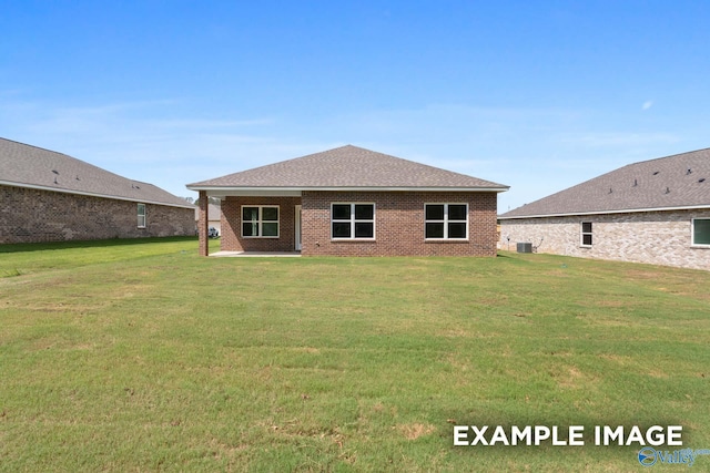 back of property featuring a yard and cooling unit