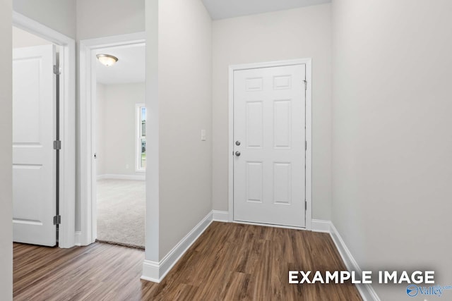 hallway featuring hardwood / wood-style floors