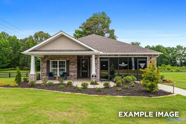 303 Keller Dr, Hazel Green, AL 35750 - craftsman-style house featuring brick siding, a porch, and board and batten siding