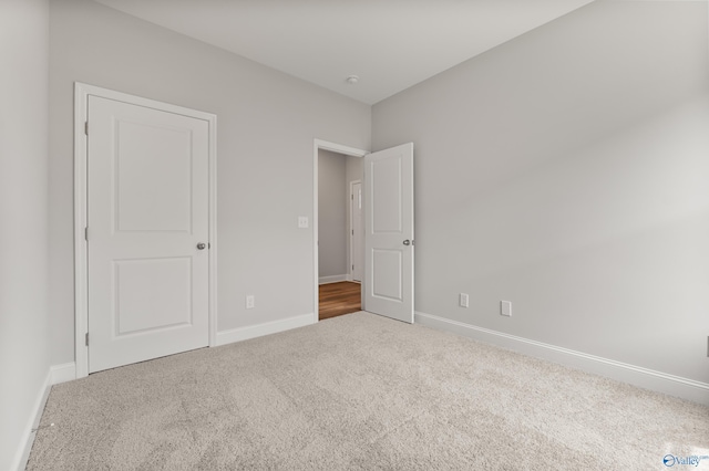 303 Keller Dr, Hazel Green, AL 35750 - unfurnished bedroom featuring carpet floors and baseboards