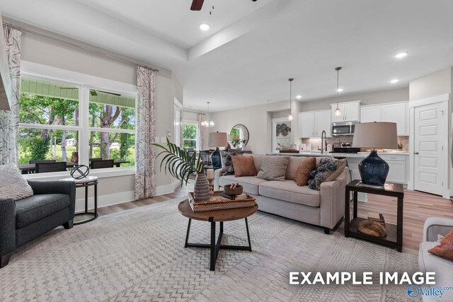 303 Keller Dr, Hazel Green, AL 35750 - living area with light wood-type flooring, a ceiling fan, recessed lighting, a chandelier, and baseboards