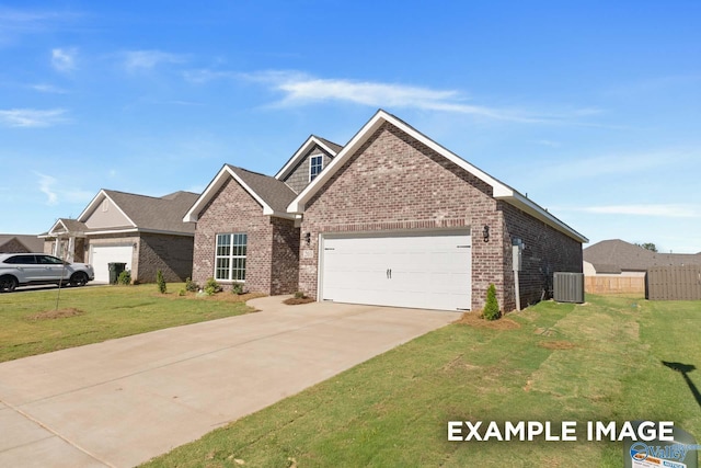 view of front of property with central AC, a garage, and a front lawn