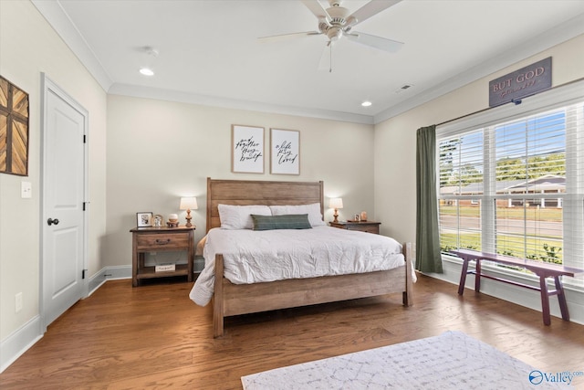 bedroom featuring wood-type flooring, ceiling fan, and crown molding