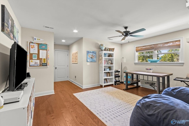 bedroom featuring wood-type flooring and ceiling fan