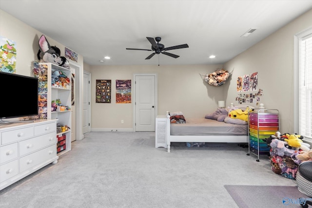 carpeted bedroom with ceiling fan