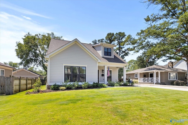 view of front of home with covered porch and a front lawn