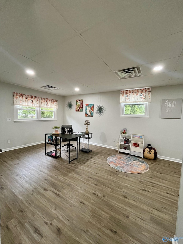 playroom featuring visible vents, baseboards, and wood finished floors