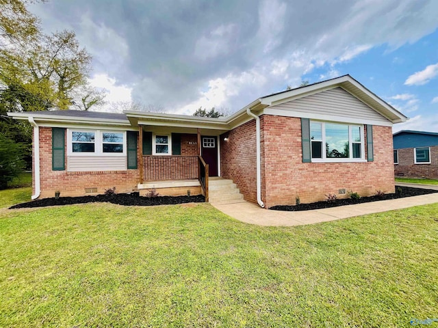 single story home featuring crawl space, a porch, a front yard, and brick siding