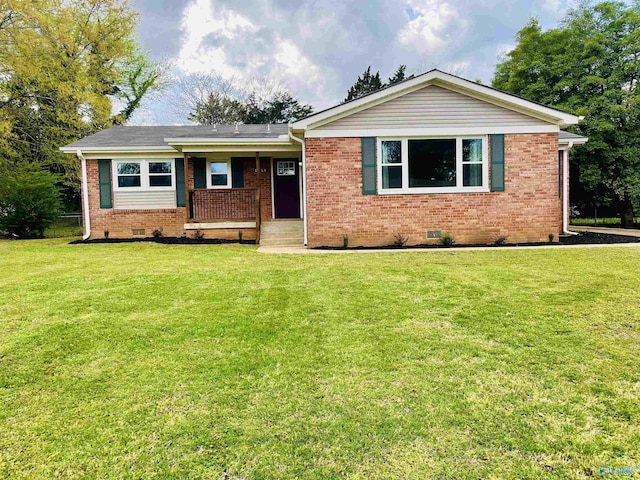 single story home featuring a front yard, brick siding, and crawl space