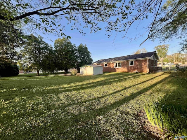view of yard with a storage shed and an outdoor structure