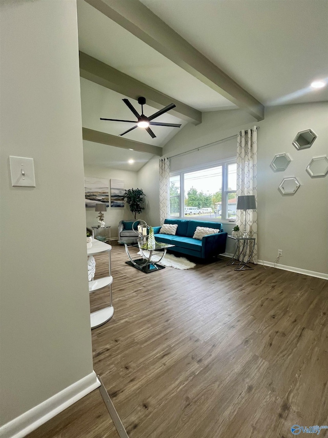 living area featuring wood finished floors, baseboards, a ceiling fan, and vaulted ceiling with beams