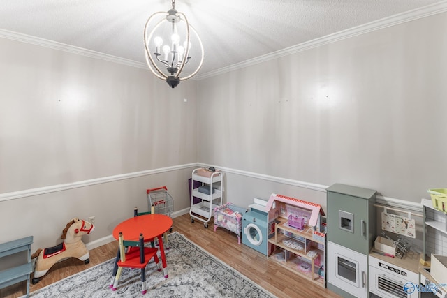 43 Terry Ln, Trinity, AL 35673 - recreation room featuring crown molding, a chandelier, and wood finished floors