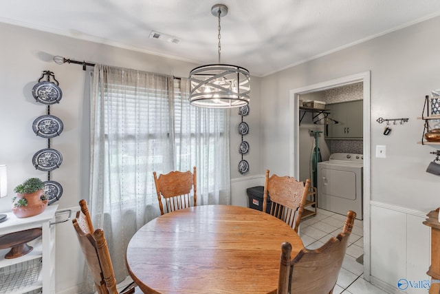 43 Terry Ln, Trinity, AL 35673 - dining room featuring washer / dryer, a chandelier, light tile patterned floors, and crown molding